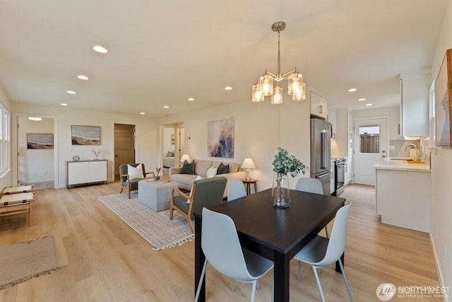 12302 5th Ave NE, Seattle, WA 98125 - dining space featuring light wood finished floors, recessed lighting, and a chandelier