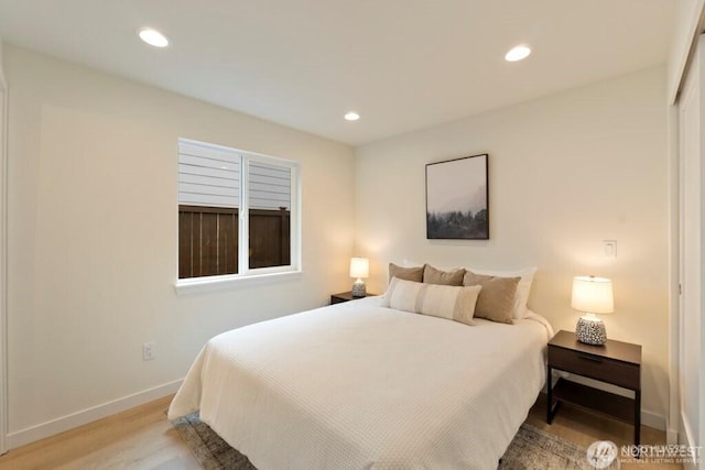 12302 5th Ave NE, Seattle, WA 98125 - bedroom featuring light wood-style flooring and recessed lighting