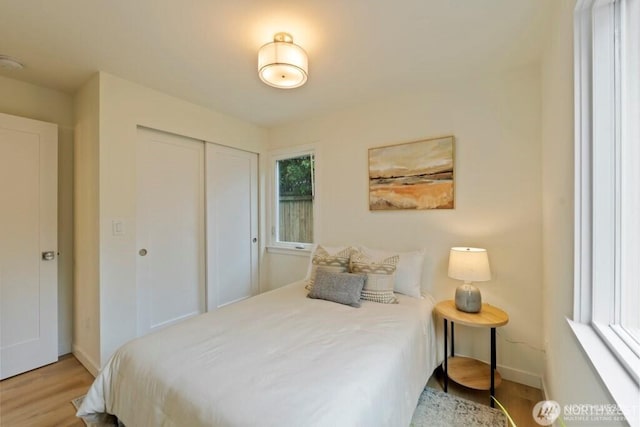 12302 5th Ave NE, Seattle, WA 98125 - bedroom with wood finished floors and a closet