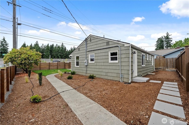 12302 5th Ave NE, Seattle, WA 98125 - view of side of home with a fenced backyard