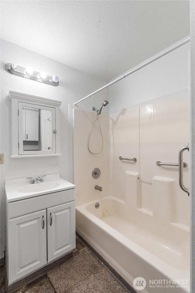 812 Duffy St, Aberdeen, WA 98520 - full bath with vanity, shower / tub combination, and a textured ceiling