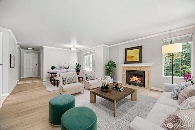 9822 NE 122nd St Unit U201, Kirkland, WA 98034 - living room featuring ornamental molding, a premium fireplace, and light wood-style floors