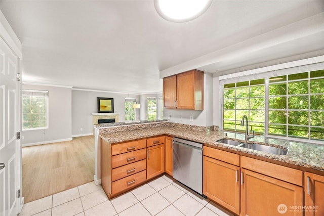 9822 NE 122nd St Unit U201, Kirkland, WA 98034 - kitchen featuring stainless steel dishwasher, open floor plan, light stone countertops, a fireplace, and ornamental molding