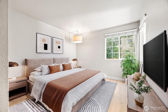 9822 NE 122nd St Unit U201, Kirkland, WA 98034 - bedroom featuring light wood-style flooring and baseboards