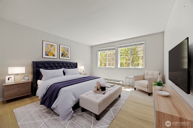 9822 NE 122nd St Unit U201, Kirkland, WA 98034 - bedroom with a baseboard heating unit and light wood-type flooring