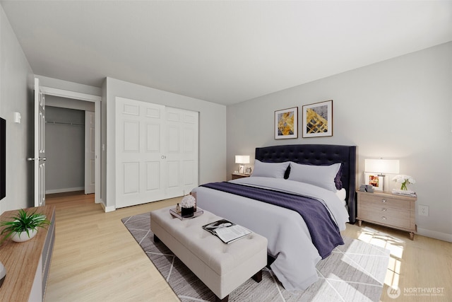 9822 NE 122nd St Unit U201, Kirkland, WA 98034 - bedroom with light wood finished floors and baseboards