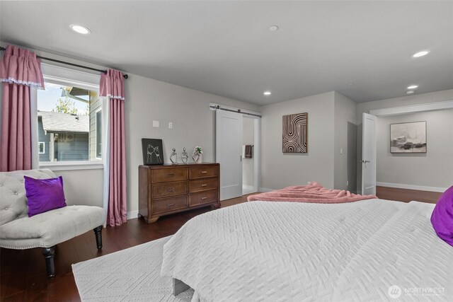 23422 26th Ave SE, Bothell, WA 98021 - bedroom featuring dark wood-type flooring, a barn door, and recessed lighting