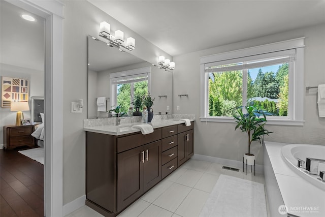 23422 26th Ave SE, Bothell, WA 98021 - bathroom with ensuite bathroom, double vanity, and a tub to relax in