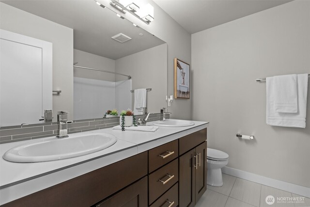 23422 26th Ave SE, Bothell, WA 98021 - full bathroom featuring double vanity, a shower, and tile patterned flooring