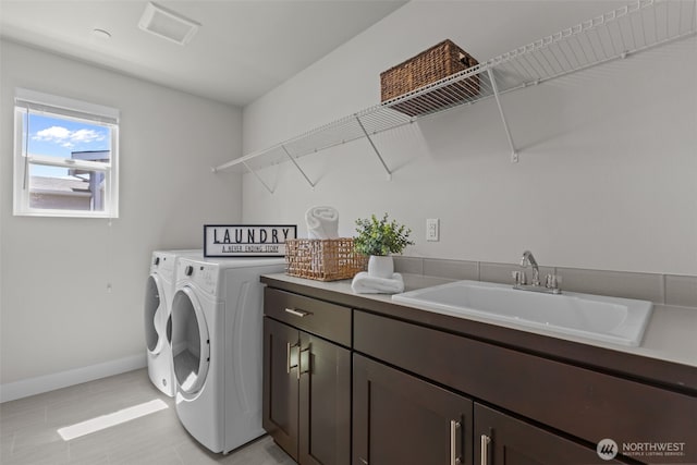 23422 26th Ave SE, Bothell, WA 98021 - washroom with cabinet space and washing machine and clothes dryer