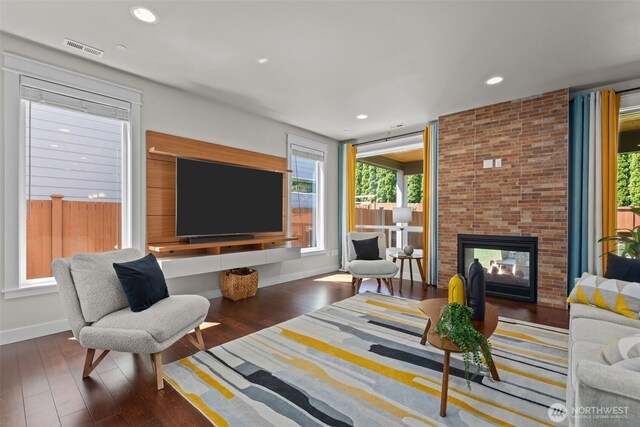 23422 26th Ave SE, Bothell, WA 98021 - living room with a brick fireplace, wood finished floors, and recessed lighting