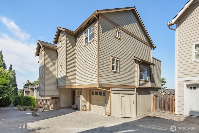 3011 Humes Pl W, Seattle, WA 98119 - view of front of house with asphalt driveway and a garage