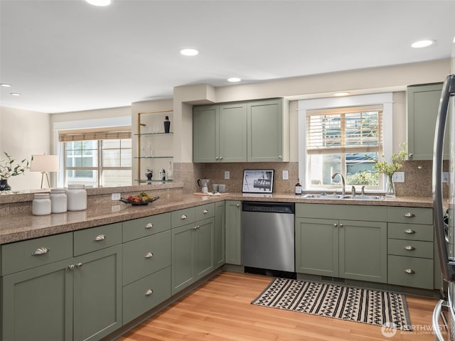 3011 Humes Pl W, Seattle, WA 98119 - kitchen featuring dishwasher, green cabinets, plenty of natural light, tasteful backsplash, and recessed lighting