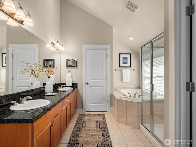 3011 Humes Pl W, Seattle, WA 98119 - full bath featuring lofted ceiling, a garden tub, double vanity, tile patterned flooring, and a shower stall