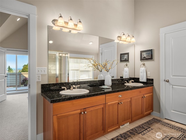 3011 Humes Pl W, Seattle, WA 98119 - full bath featuring double vanity, a shower stall, high vaulted ceiling, and tile patterned floors