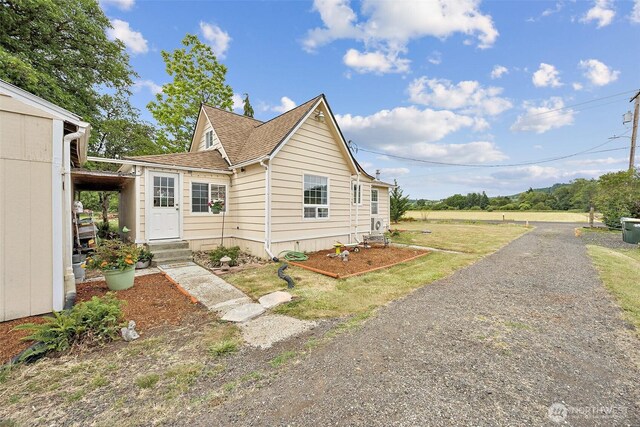 143 Mauerman Rd, Chehalis, WA 98532 - view of front facade with a shingled roof, dirt driveway, and entry steps