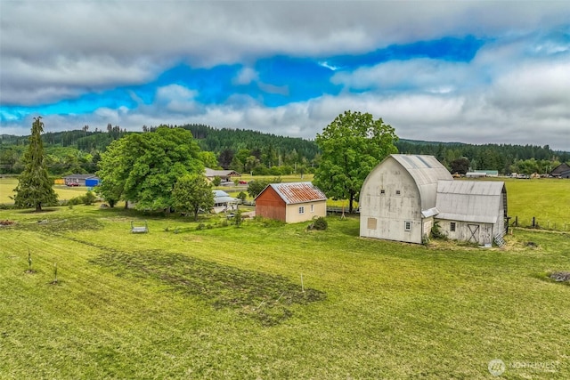 143 Mauerman Rd, Chehalis, WA 98532 - view of green lawn with a barn, an outdoor structure, and a view of trees