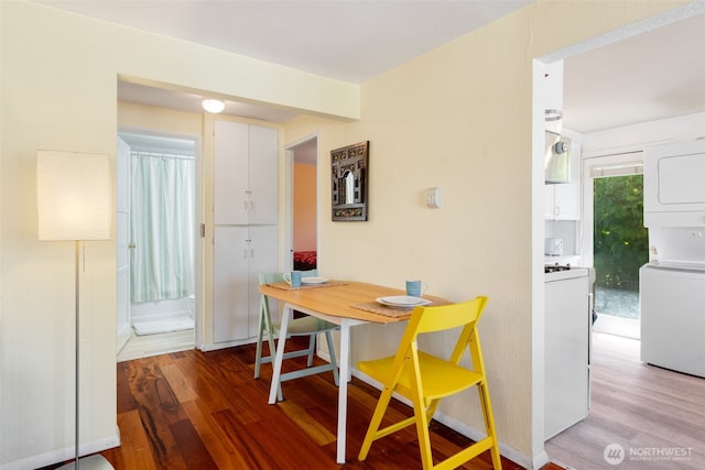 1524 30th Ave, Seattle, WA 98122 - dining space with wood finished floors and stacked washer and clothes dryer