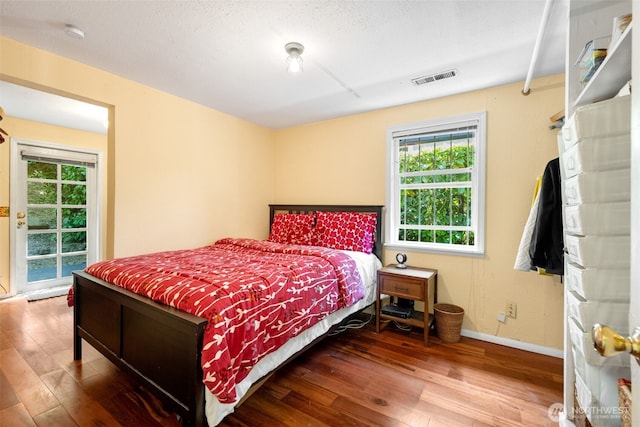 1524 30th Ave, Seattle, WA 98122 - bedroom with wood finished floors and multiple windows