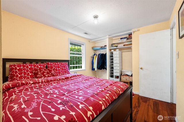 1524 30th Ave, Seattle, WA 98122 - bedroom featuring dark wood-style flooring and a closet