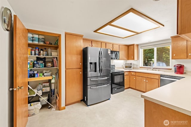 50 Steve Pl, Sequim, WA 98382 - kitchen with black appliances, light countertops, and light flooring