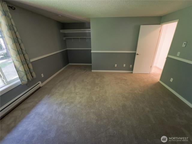 1717 150th Ave SE Unit 31, Bellevue, WA 98007 - unfurnished room with a baseboard radiator, a textured ceiling, and carpet flooring