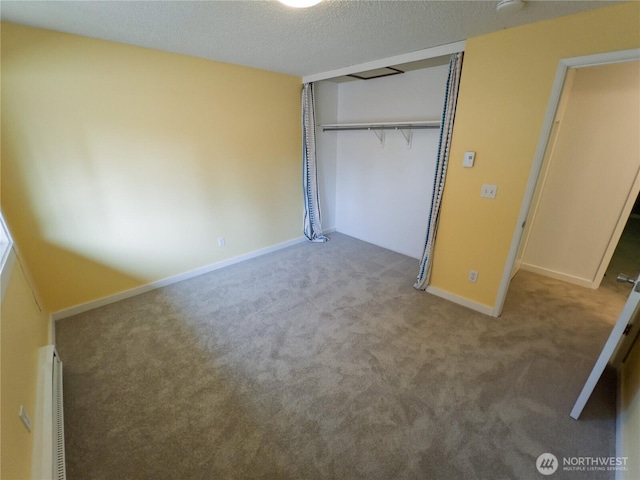 1717 150th Ave SE Unit 31, Bellevue, WA 98007 - unfurnished bedroom featuring carpet floors, a closet, and a textured ceiling