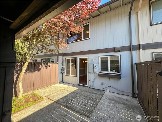 1717 150th Ave SE Unit 31, Bellevue, WA 98007 - view of exterior entry with a patio