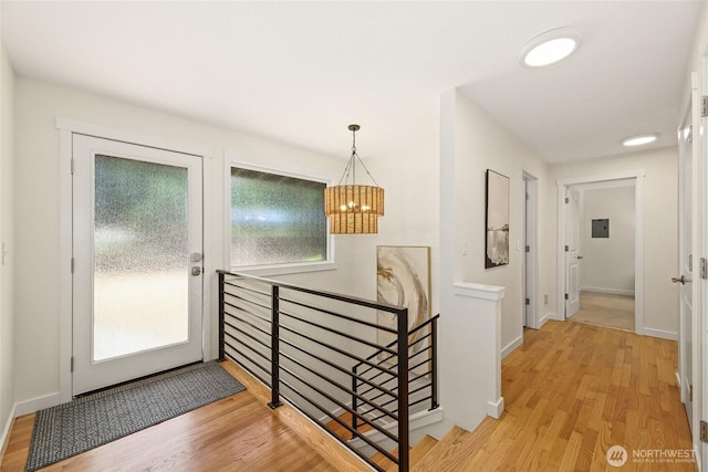 10032 35th Ave NE, Seattle, WA 98125 - foyer entrance with a chandelier and light wood-style flooring