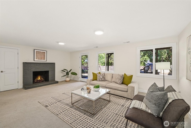 10032 35th Ave NE, Seattle, WA 98125 - carpeted living area featuring a brick fireplace and baseboards