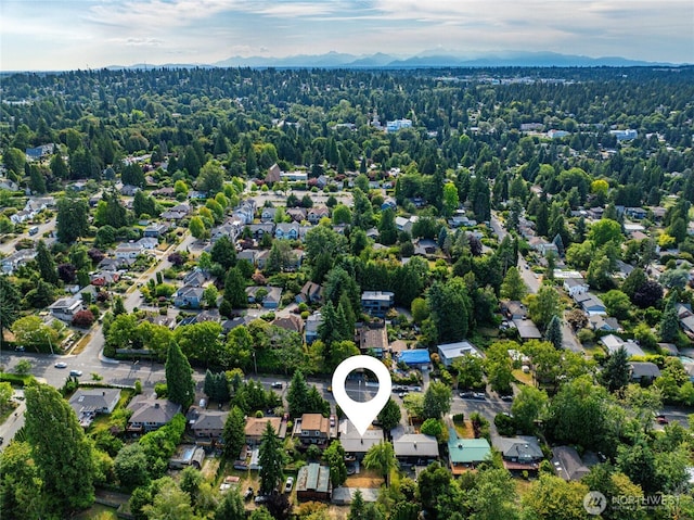 10032 35th Ave NE, Seattle, WA 98125 - aerial view of property and surrounding area featuring a mountainous background and nearby suburban area