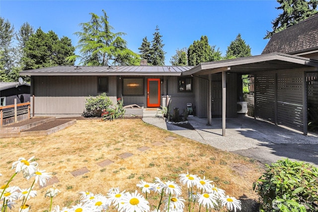 10032 35th Ave NE, Seattle, WA 98125 - view of front of house with a garden, a metal roof, and a standing seam roof