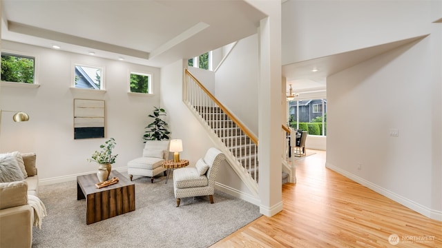 17303 SE 185th St, Renton, WA 98058 - living area featuring stairs, healthy amount of natural light, wood finished floors, recessed lighting, and a tray ceiling