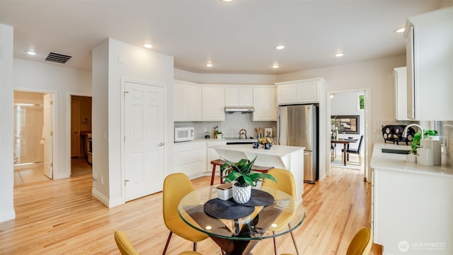17303 SE 185th St, Renton, WA 98058 - dining area featuring light wood-type flooring and recessed lighting