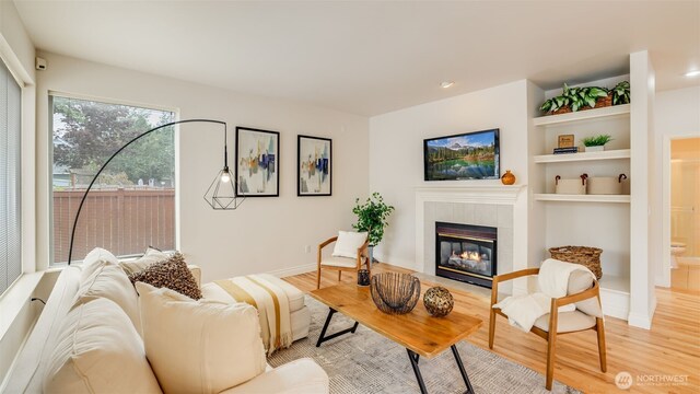 17303 SE 185th St, Renton, WA 98058 - living room with light wood-style flooring and a fireplace