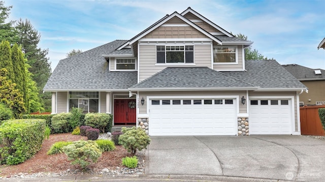 17303 SE 185th St, Renton, WA 98058 - craftsman house featuring a shingled roof, driveway, a garage, and stone siding