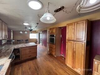 29024 38th Ave S, Auburn, WA 98001 - kitchen with stainless steel oven, a peninsula, dark wood-type flooring, and an office area