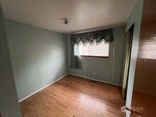 29024 38th Ave S, Auburn, WA 98001 - unfurnished dining area with wood finished floors and baseboards