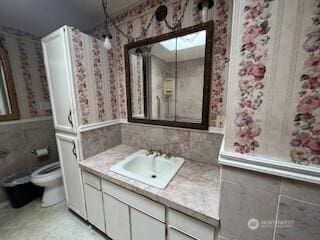 29024 38th Ave S, Auburn, WA 98001 - full bath featuring vanity, wallpapered walls, and a wainscoted wall