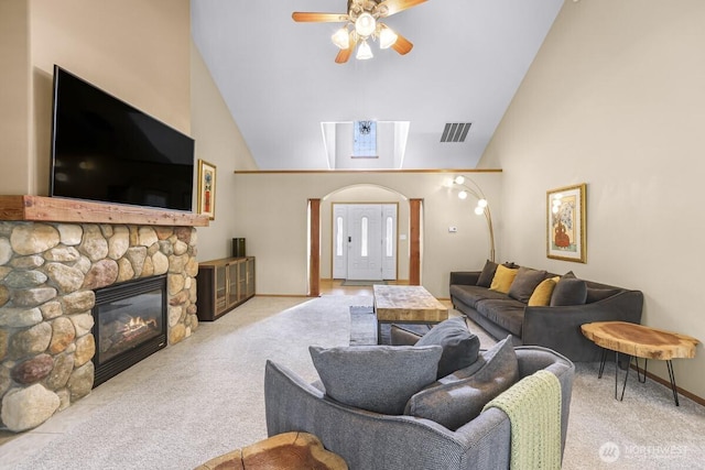 1307 Birchwood Dr, Everson, WA 98247 - carpeted living area with ceiling fan, a stone fireplace, and high vaulted ceiling