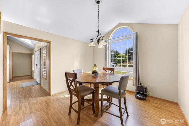 1307 Birchwood Dr, Everson, WA 98247 - dining room featuring vaulted ceiling, a chandelier, and light wood-style flooring