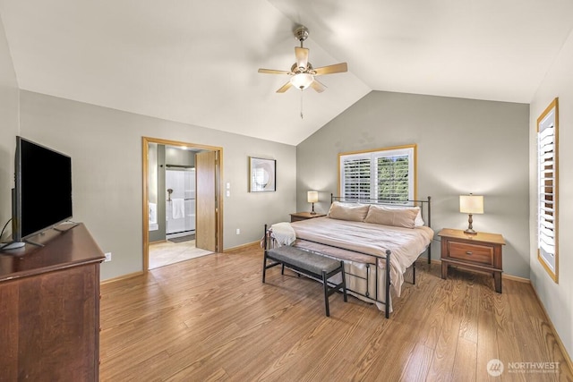 1307 Birchwood Dr, Everson, WA 98247 - bedroom with light wood finished floors, vaulted ceiling, a ceiling fan, and ensuite bathroom