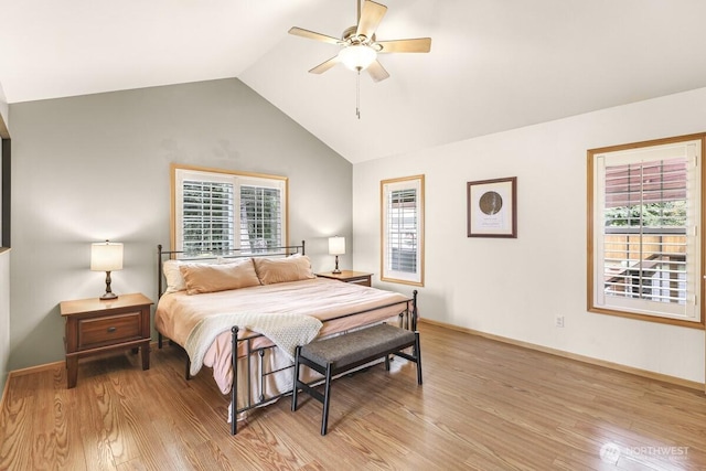1307 Birchwood Dr, Everson, WA 98247 - bedroom with light wood finished floors, multiple windows, vaulted ceiling, and ceiling fan