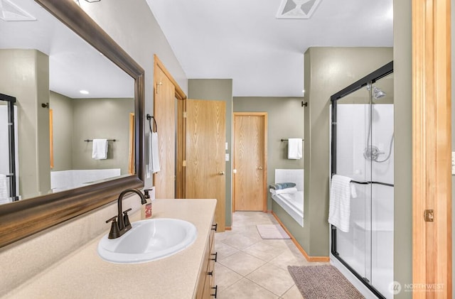 1307 Birchwood Dr, Everson, WA 98247 - bathroom with vanity, a garden tub, a stall shower, and tile patterned floors
