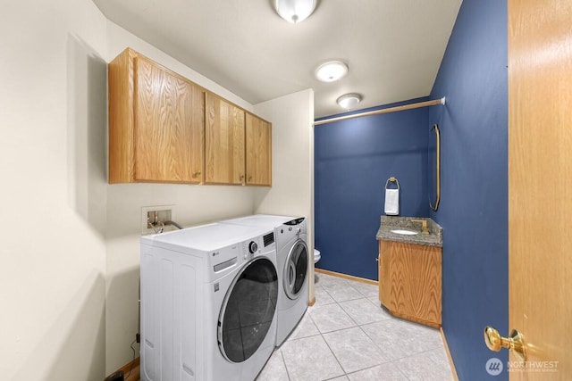 1307 Birchwood Dr, Everson, WA 98247 - laundry area with washer and clothes dryer, cabinet space, and light tile patterned flooring