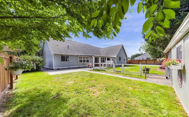 1307 Birchwood Dr, Everson, WA 98247 - rear view of house with a patio area and a shingled roof