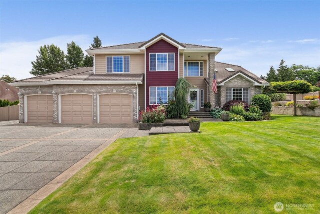 4618 51st Street Ct E, Tacoma, WA 98443 - view of front of home featuring asphalt driveway and a garage
