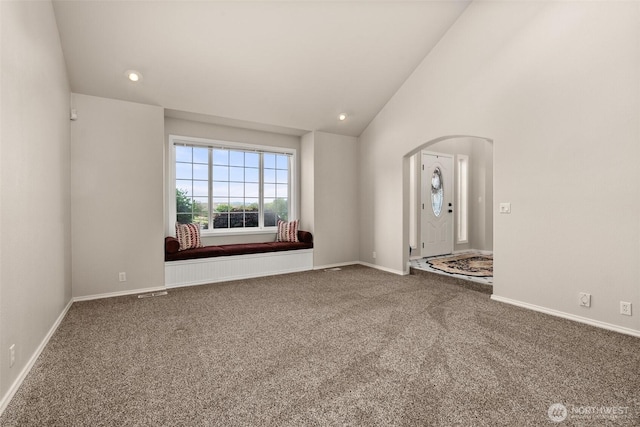 4618 51st Street Ct E, Tacoma, WA 98443 - empty room featuring arched walkways, carpet, lofted ceiling, and recessed lighting
