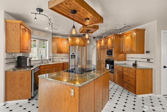 4618 51st Street Ct E, Tacoma, WA 98443 - kitchen with appliances with stainless steel finishes, light flooring, a center island, dark stone counters, and tasteful backsplash