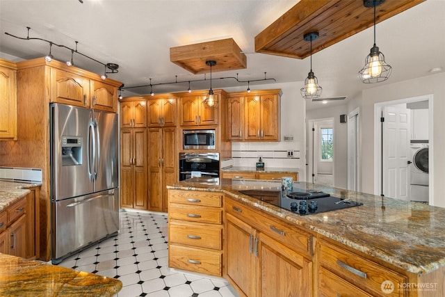 4618 51st Street Ct E, Tacoma, WA 98443 - kitchen with stainless steel appliances, track lighting, stone countertops, and washer / clothes dryer